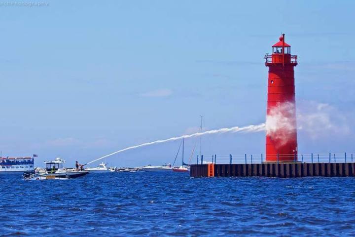 red ship in a body of water