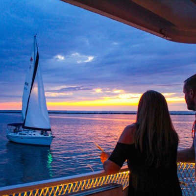 a group of people in a boat on a body of water