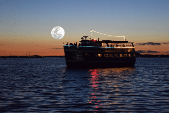 a close up of a boat next to a body of water