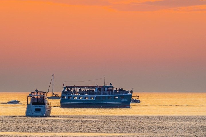 a boat on a beach near a body of water