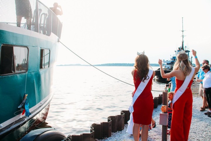 a group of people on a boat in the water