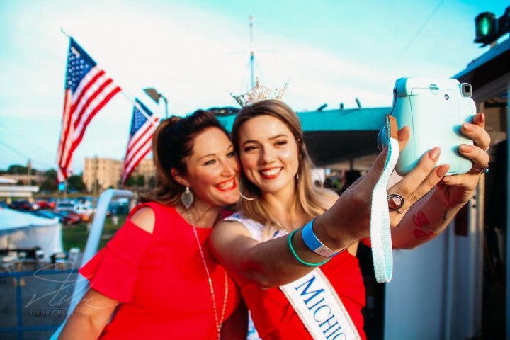 manon locas holding a cell phone